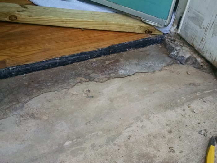 How to repair the concrete sill under our front door